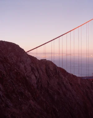 This six-panel panoramic photograph shows the Golden Gate Bridge spanning from the Marin Headlands over to San Francisco.