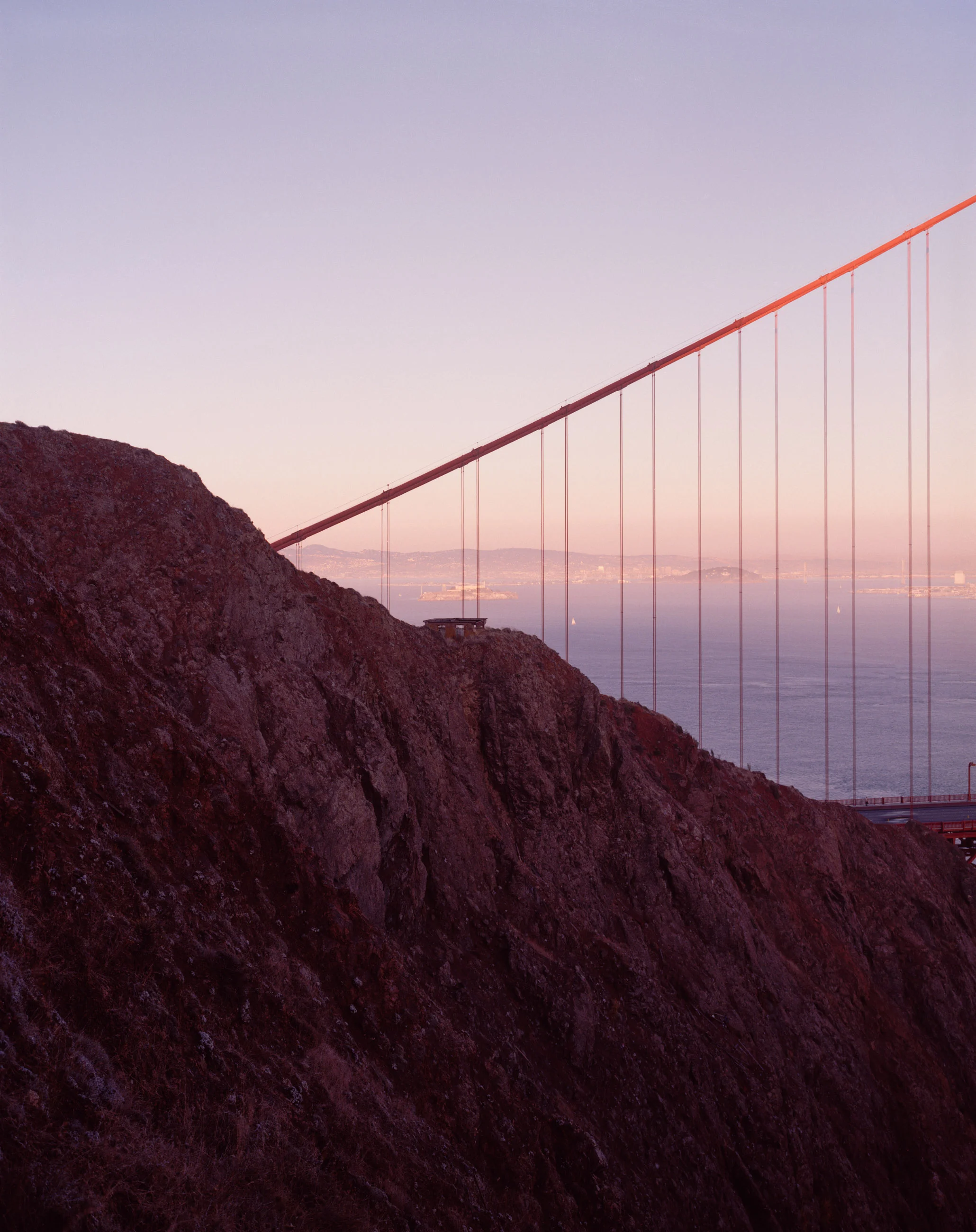 This six-panel panoramic photograph shows the Golden Gate Bridge spanning from the Marin Headlands over to San Francisco.