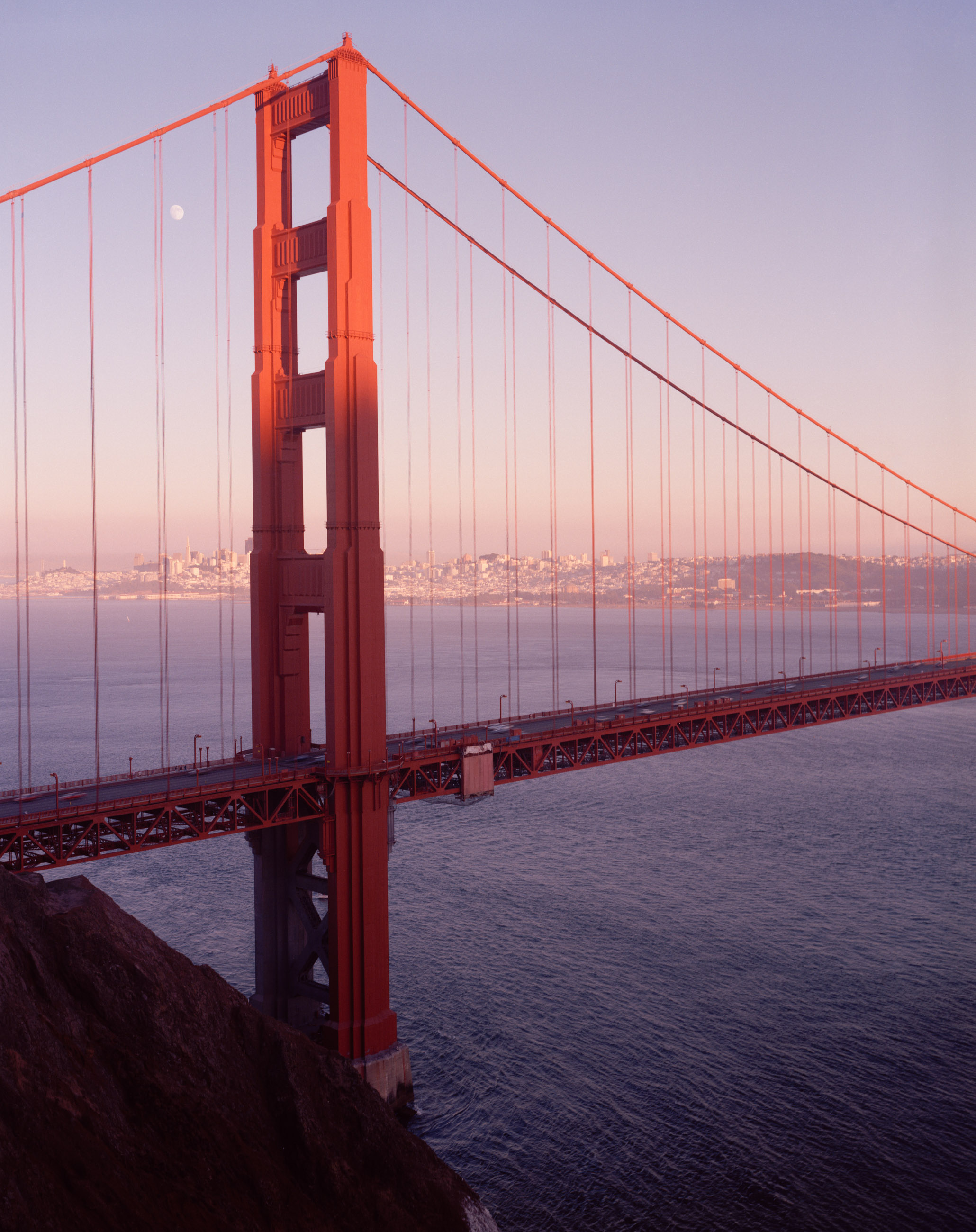 This six-panel panoramic photograph shows the Golden Gate Bridge spanning from the Marin Headlands over to San Francisco.