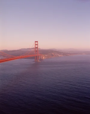 This six-panel panoramic photograph shows the Golden Gate Bridge spanning from the Marin Headlands over to San Francisco.