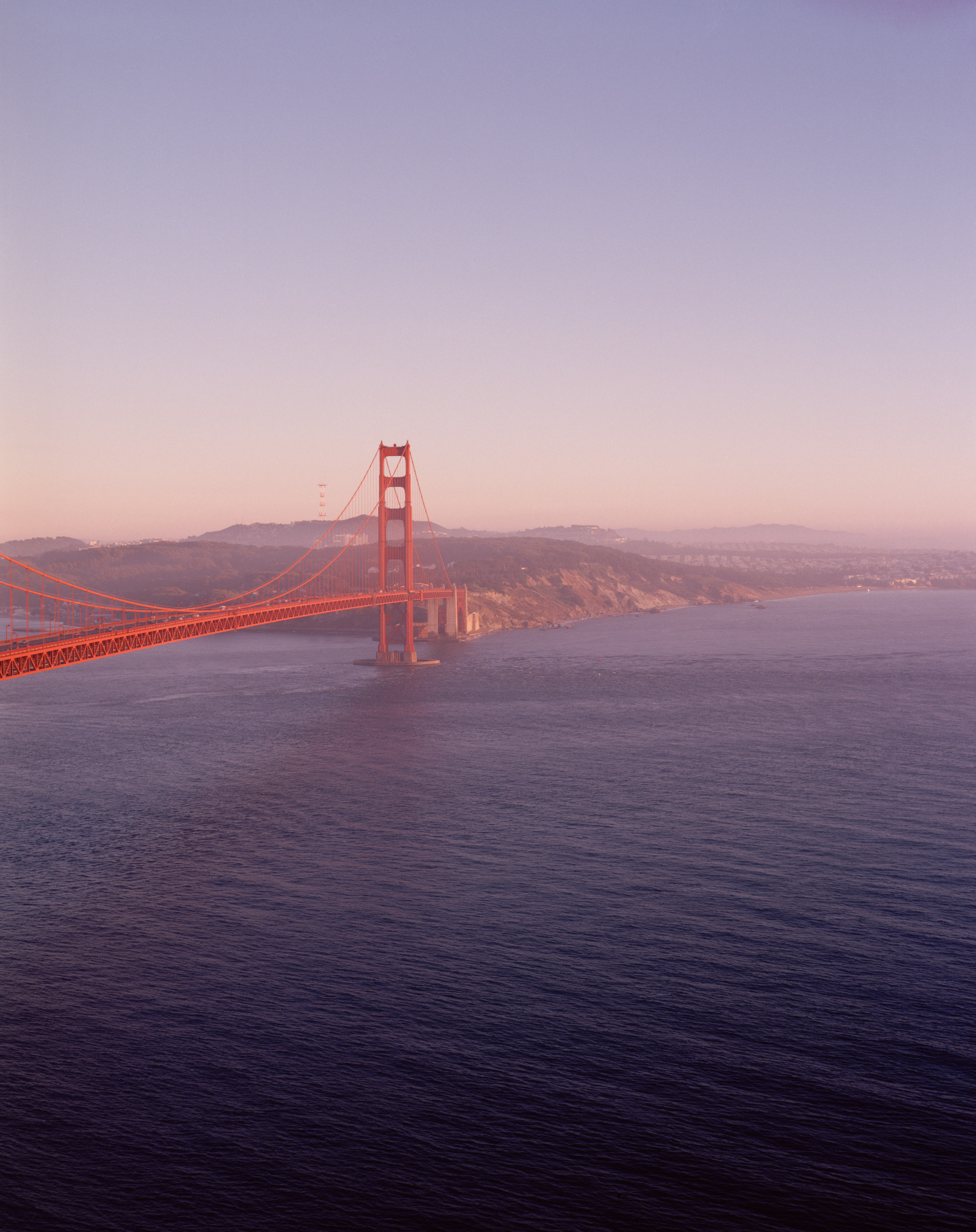 This six-panel panoramic photograph shows the Golden Gate Bridge spanning from the Marin Headlands over to San Francisco.