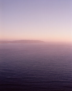 This six-panel panoramic photograph shows the Golden Gate Bridge spanning from the Marin Headlands over to San Francisco.