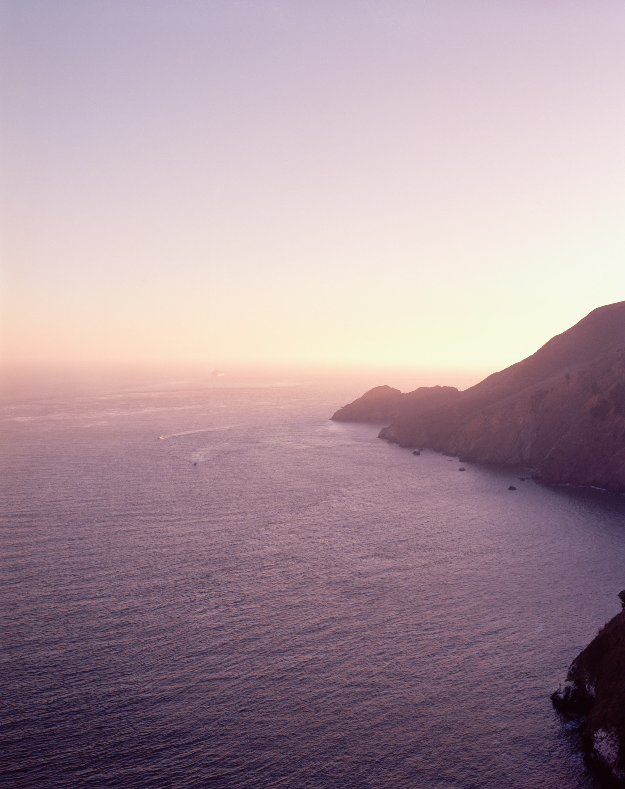 This six-panel panoramic photograph shows the Golden Gate Bridge spanning from the Marin Headlands over to San Francisco.
