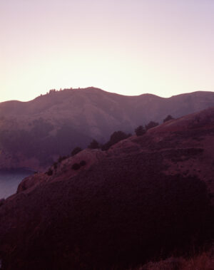 This six-panel panoramic photograph shows the Golden Gate Bridge spanning from the Marin Headlands over to San Francisco.